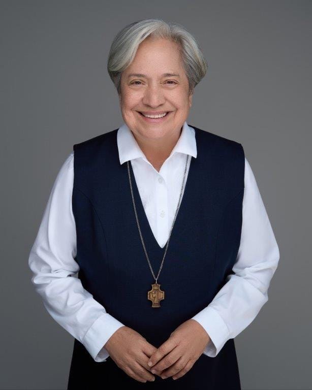 Sister Norma Pimentel smiling against a gray background.